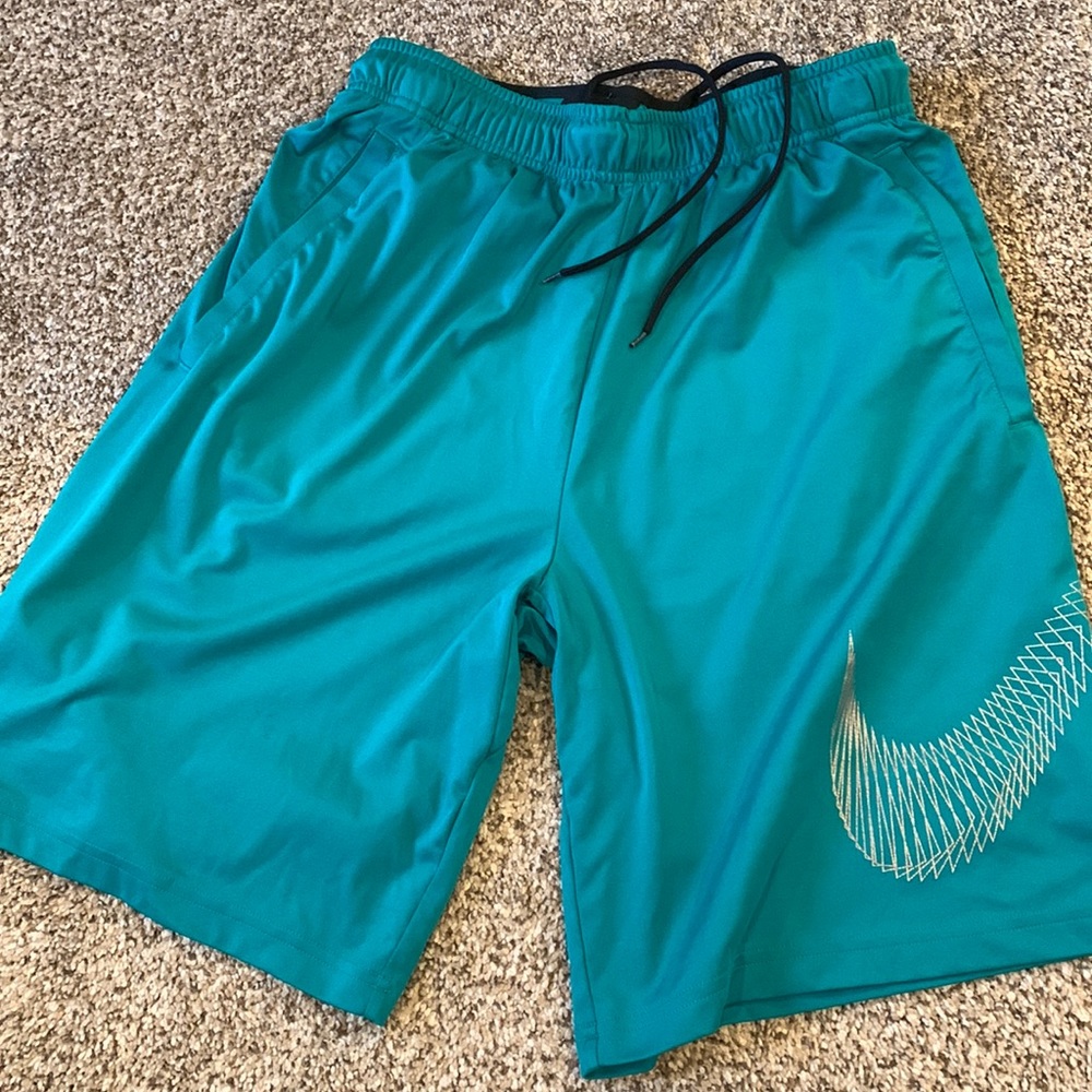 Teal Medium Nike shorts. Used, good Condition. Side pockets and draw string